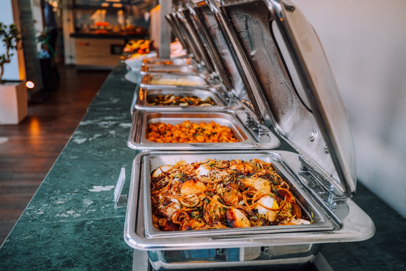 Assorted Cooked Foods Inside Food Warmers